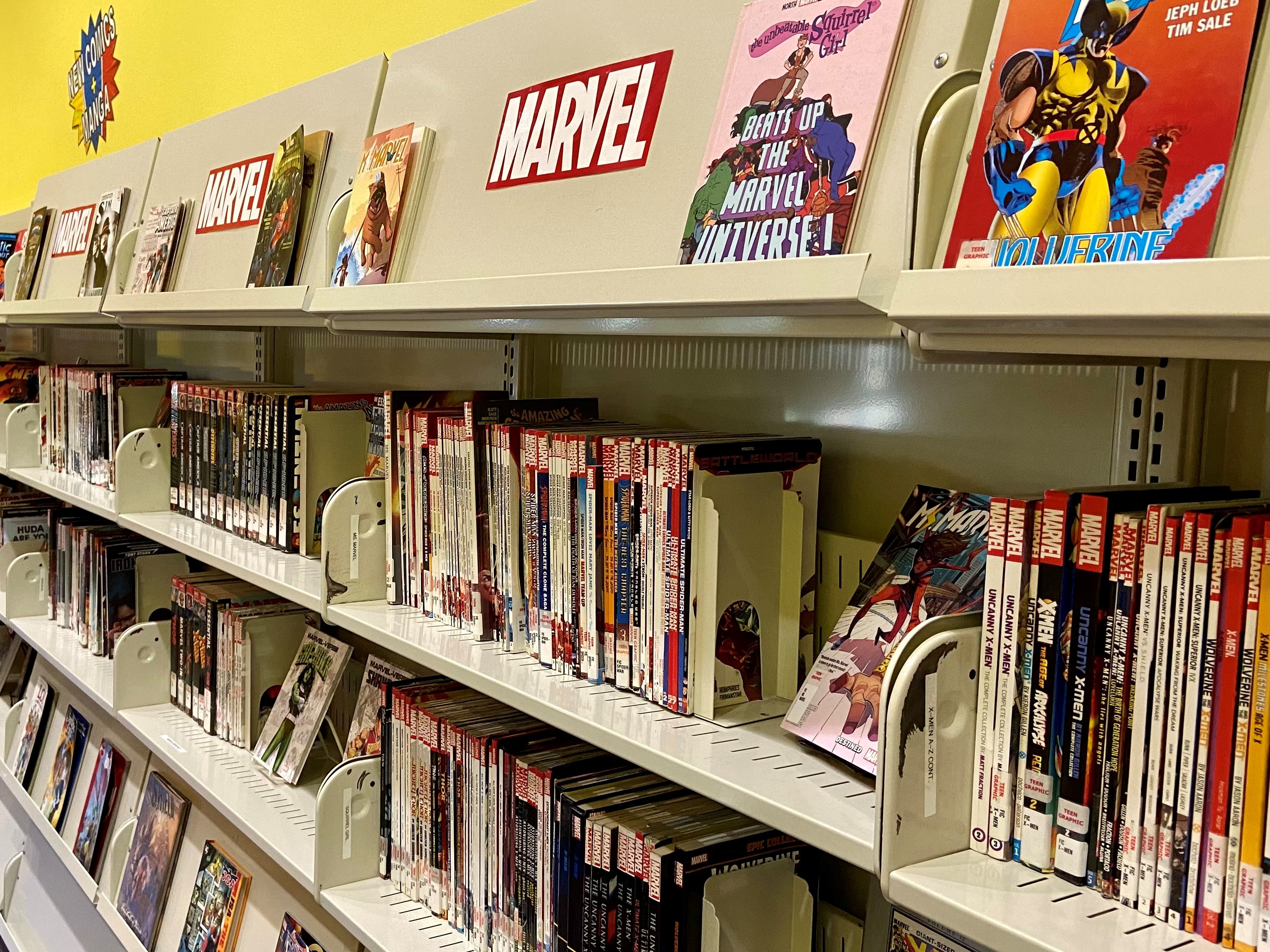 comics and graphic novels on book shelves